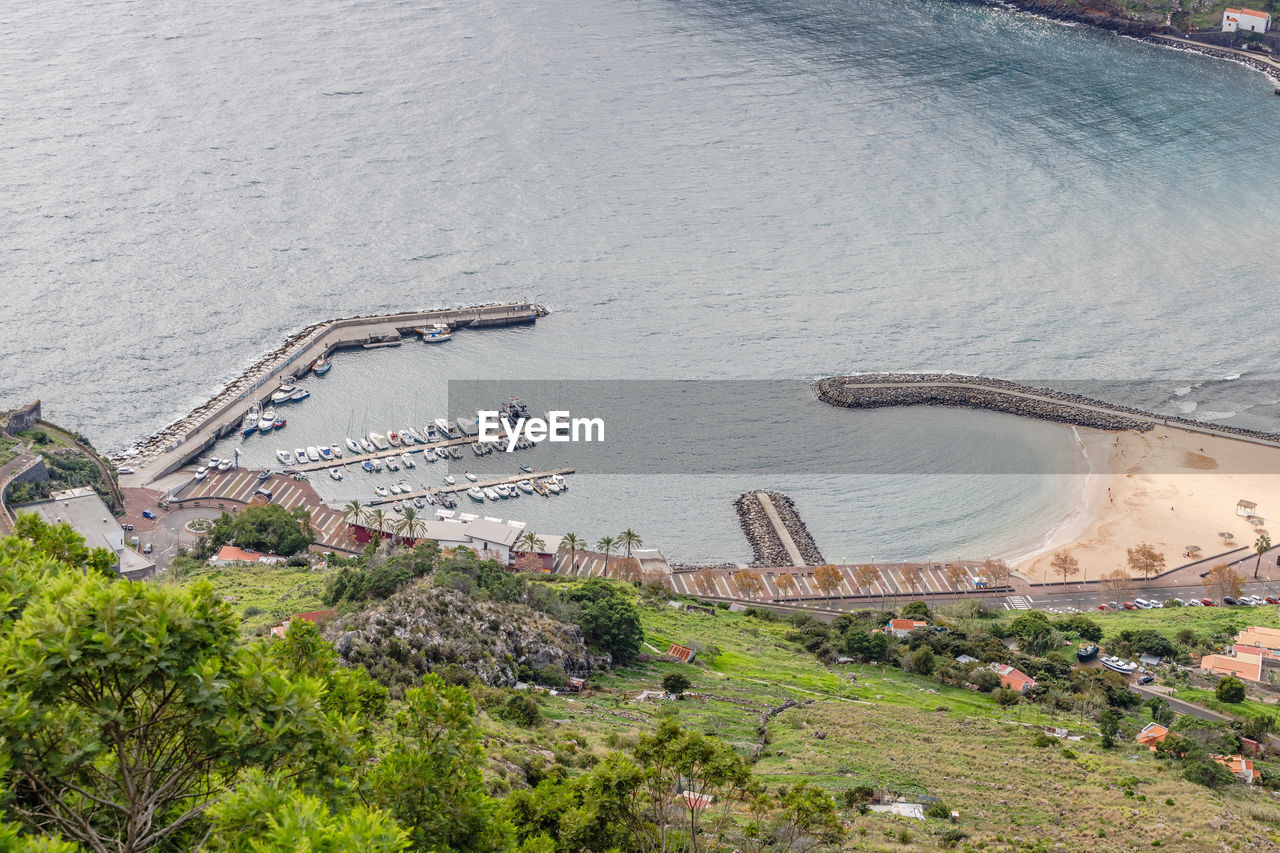 high angle view of cityscape by sea