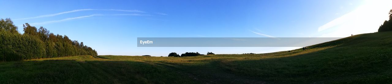 PANORAMIC SHOT OF FIELD AGAINST SKY