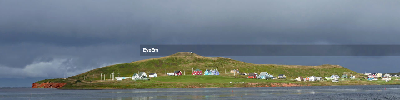 Panoramic view of building against cloudy sky