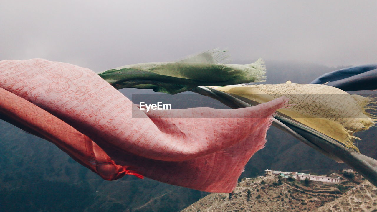 Prayer flags waving above mountains
