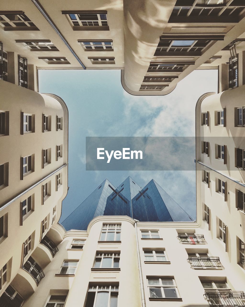 LOW ANGLE VIEW OF BUILDINGS AGAINST SKY