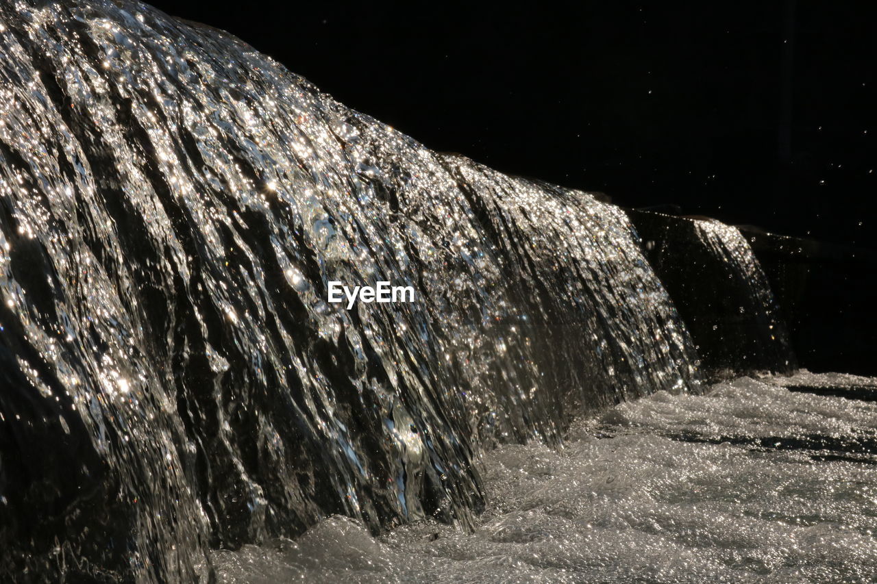 CLOSE-UP OF WATER AGAINST SKY
