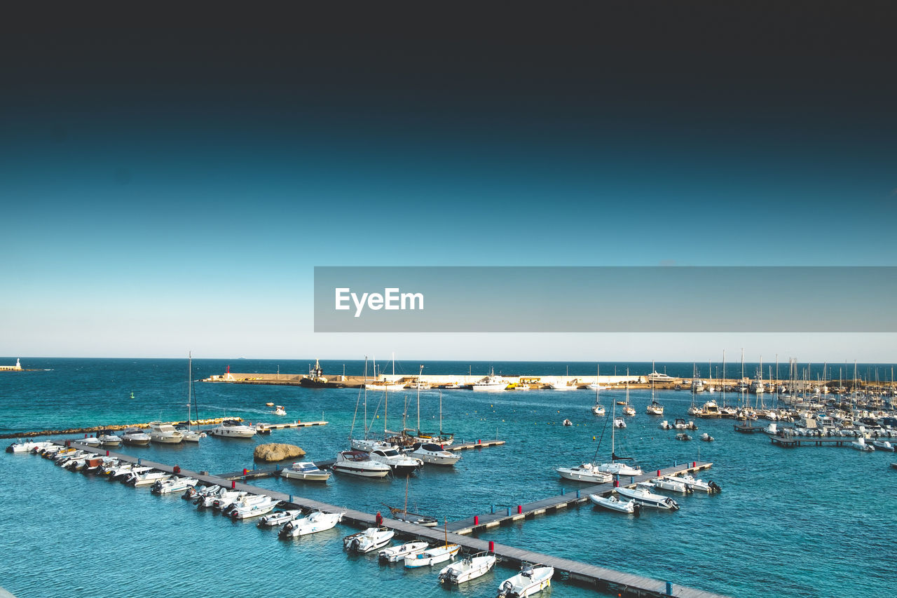 Scenic view of sea against clear blue sky