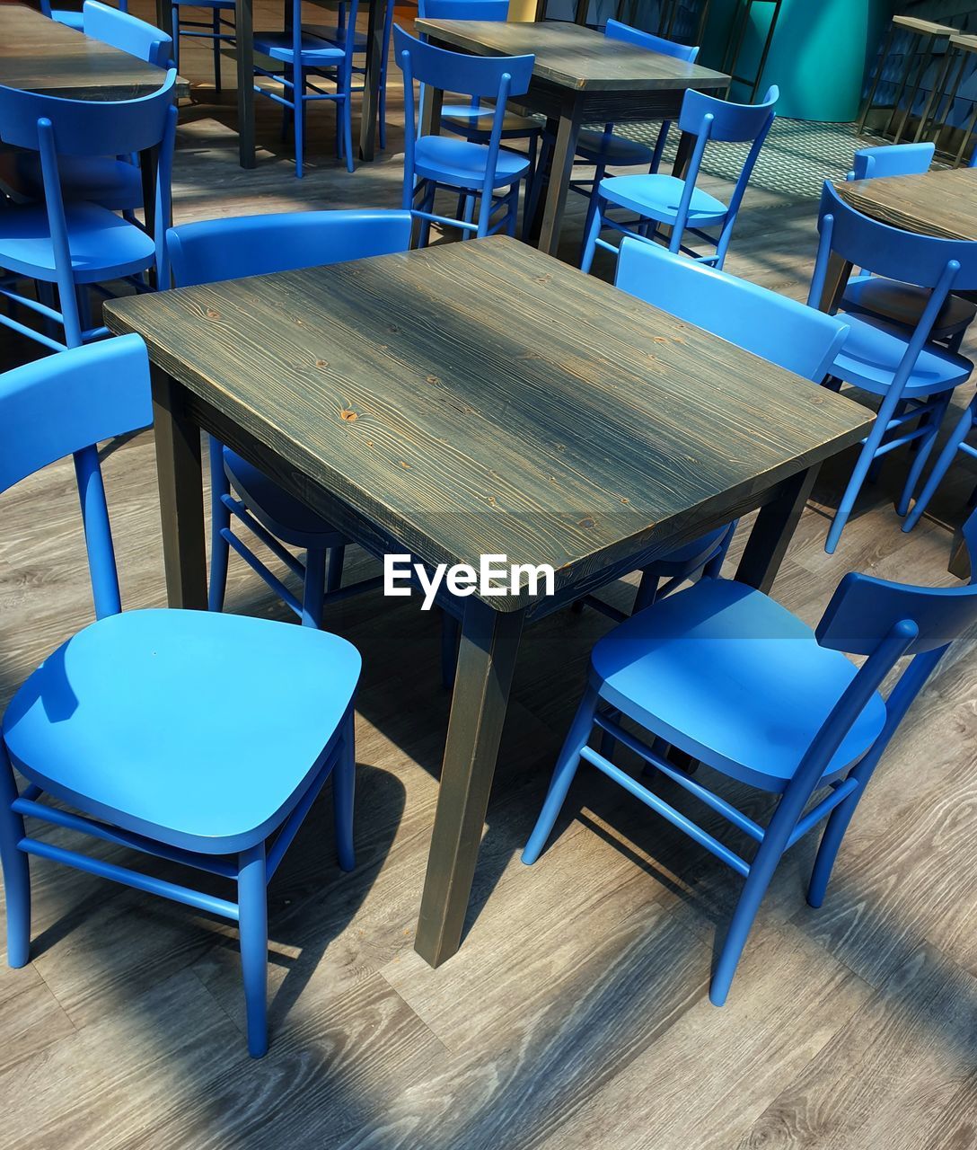 EMPTY CHAIRS AND TABLE AT RESTAURANT