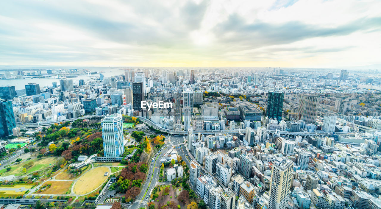 HIGH ANGLE VIEW OF CITY BUILDINGS AGAINST SKY