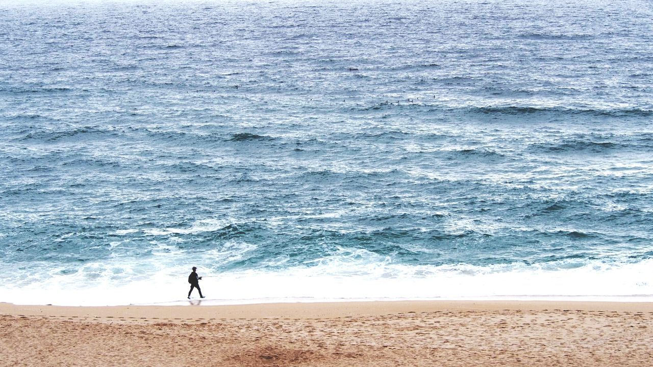 Person walking at beach