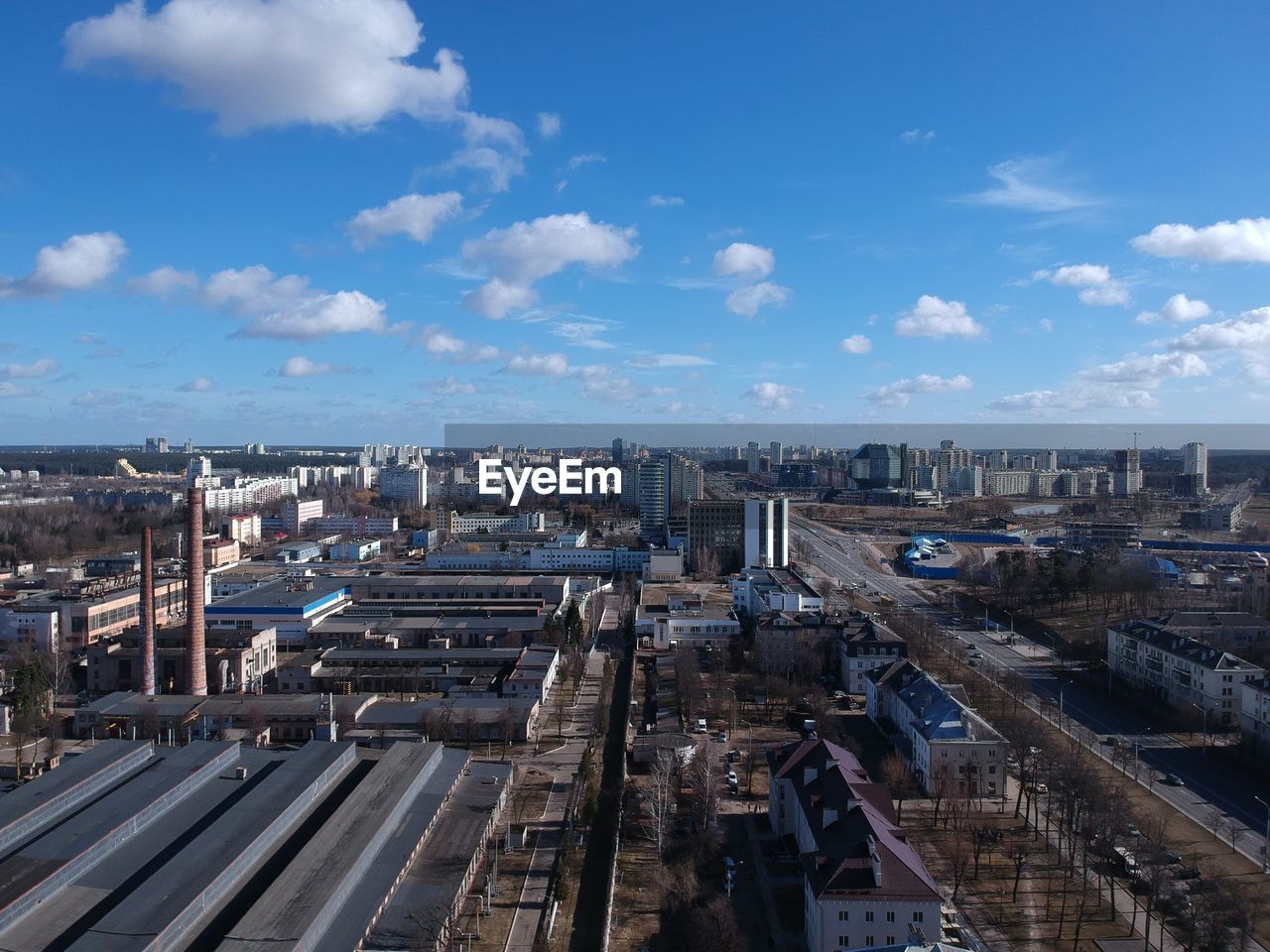 High angle view of buildings in city against sky