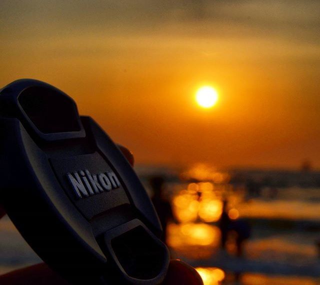 CLOSE-UP OF CROPPED CAR AT SUNSET