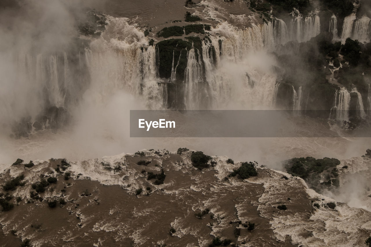 PANORAMIC VIEW OF WATERFALL IN FOREST