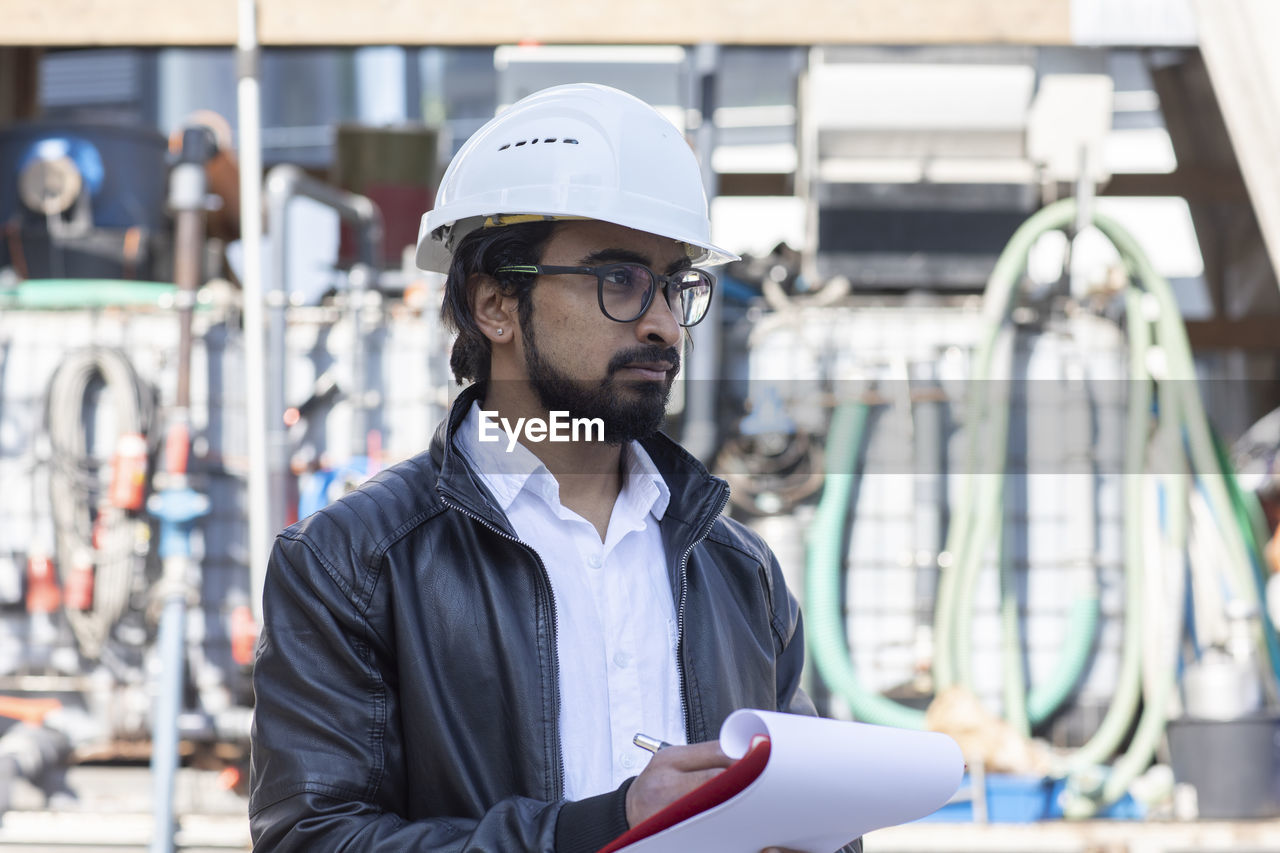 Service engineer working outside with helmet