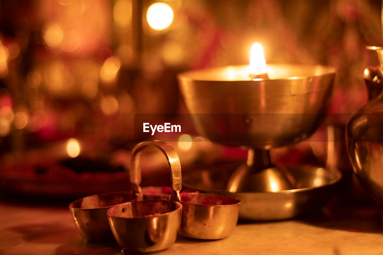 Close-up of illuminated indian traditional oil lamp called 'diya'.