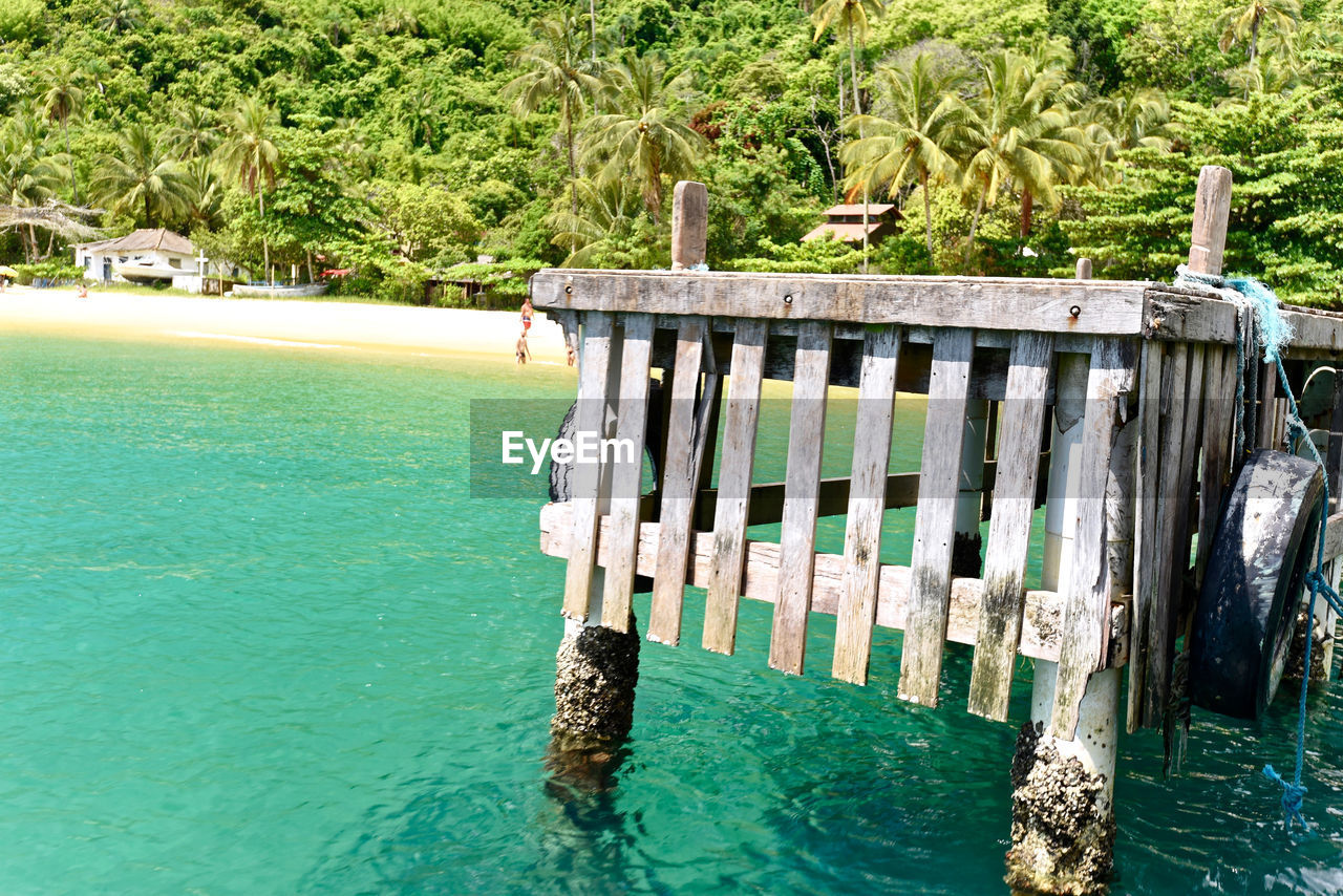 WOODEN POSTS IN SWIMMING POOL