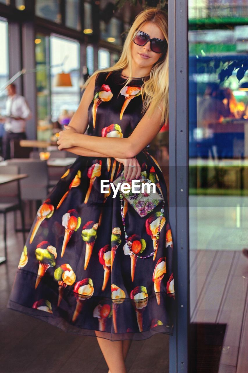 Woman wearing sunglasses standing outdoors