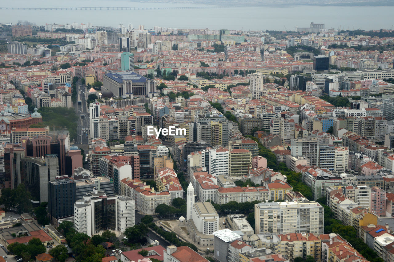 High angle view of buildings in city against sky