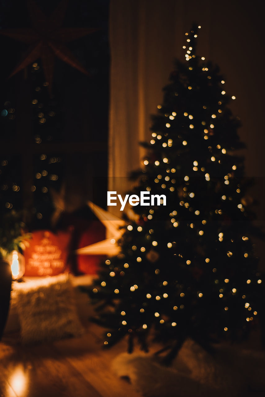 Illuminated christmas tree at night