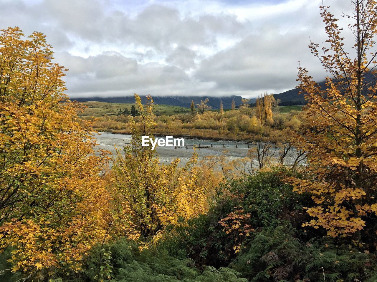 Lake along countryside landscape