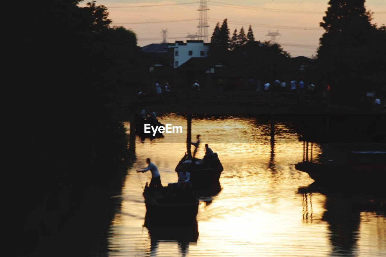 VIEW OF RIVER WITH BUILDINGS IN BACKGROUND