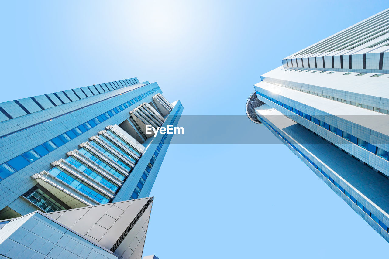 Low angle view of modern buildings against clear sky