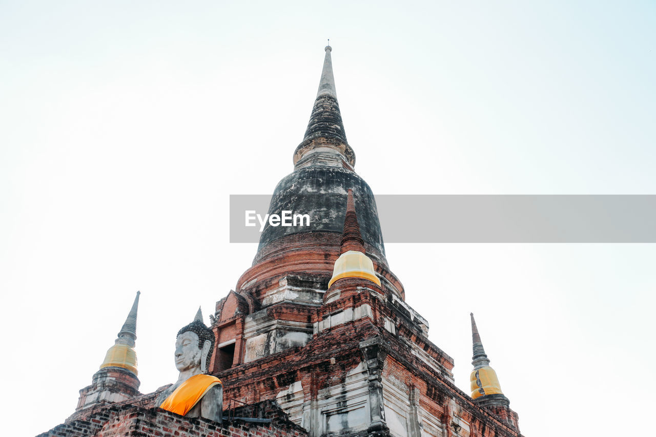 Low angle view of temple building against clear sky