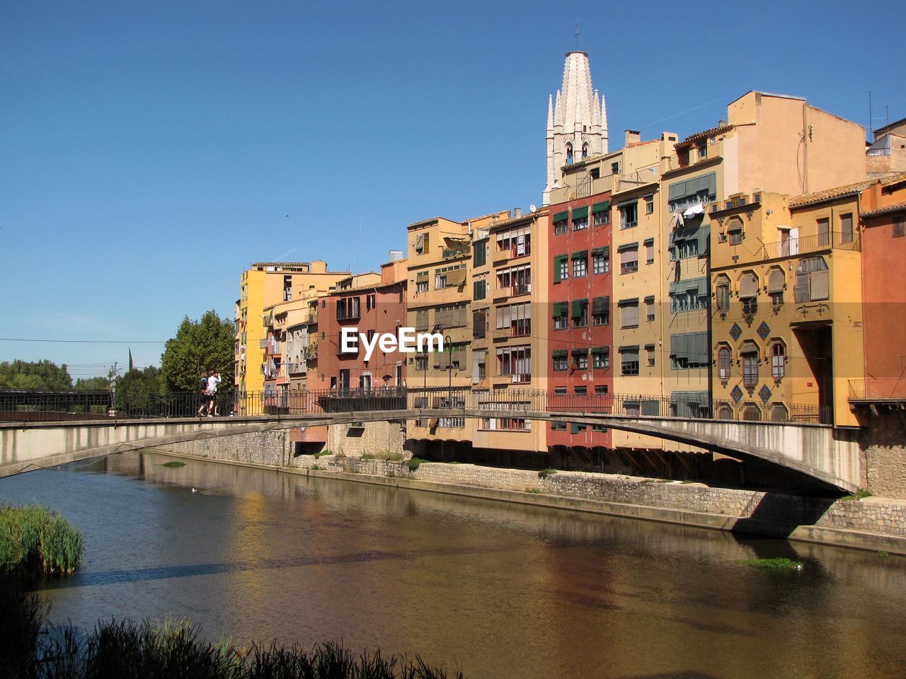 Buildings against clear sky with waterfront