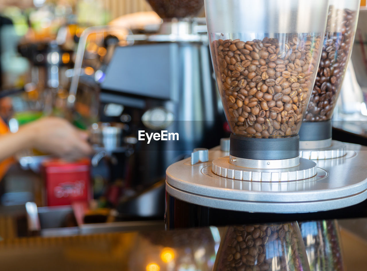 food and drink, business, coffee, cafe, drink, indoors, meal, coffeemaker, coffee shop, food, hand, occupation, business finance and industry, close-up, adult, food and drink industry, selective focus, barista, restaurant, small business, espresso maker, refreshment, working, pouring