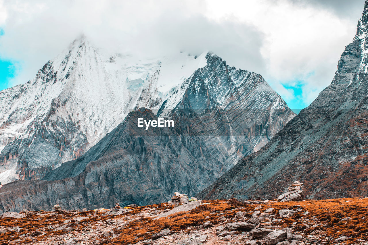 Scenic view of snowcapped mountains against sky