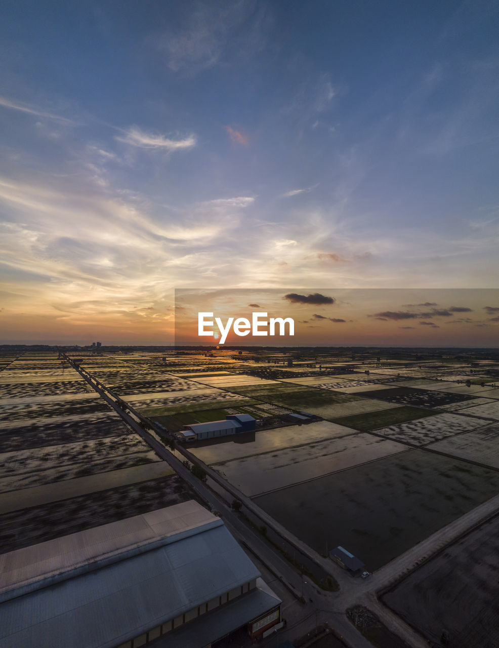 Aerial view of landscape against sky during sunset