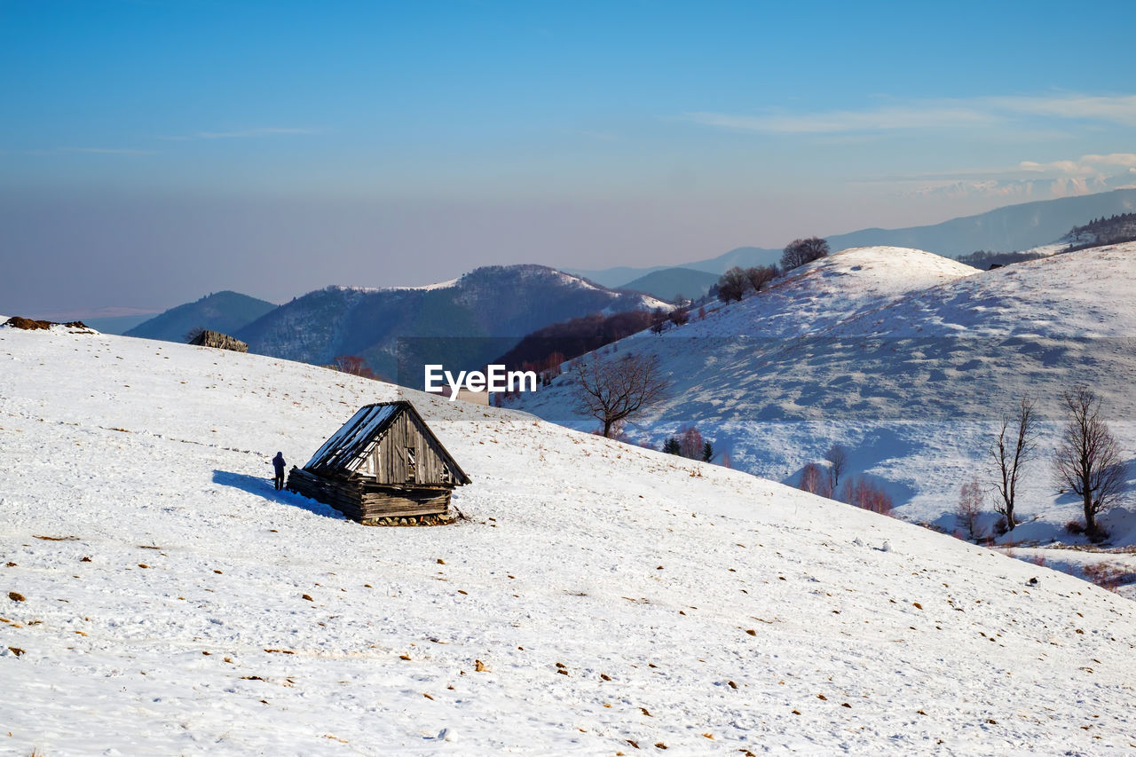 Sun over the winter mountains with snow, cindrel mountains, paltinis, romania