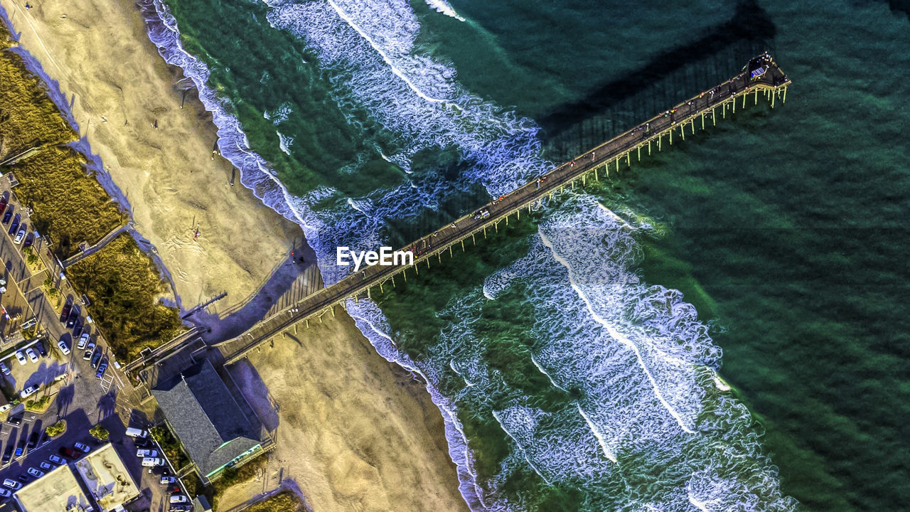 HIGH ANGLE VIEW OF WATER FALLING FROM SEA