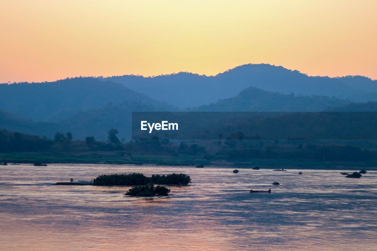 Scenic view of mountains against sky during sunset