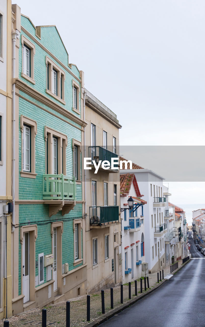 An empty old street leading to the ocean, in the historic center of the portuguese city of nazare