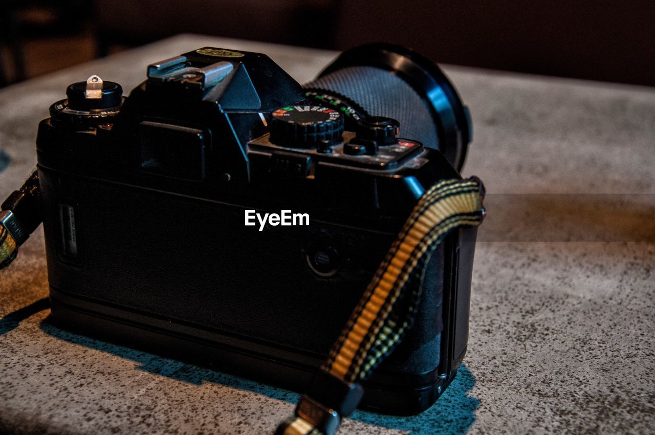 Close-up of camera on table