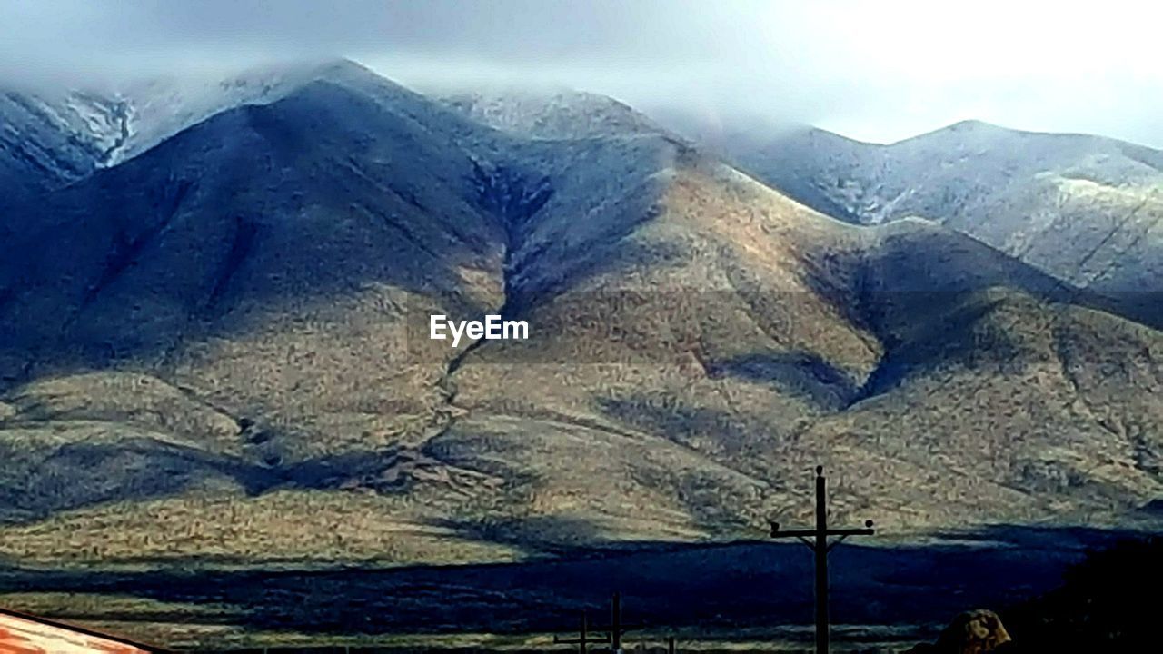 MOUNTAIN RANGE AGAINST SKY