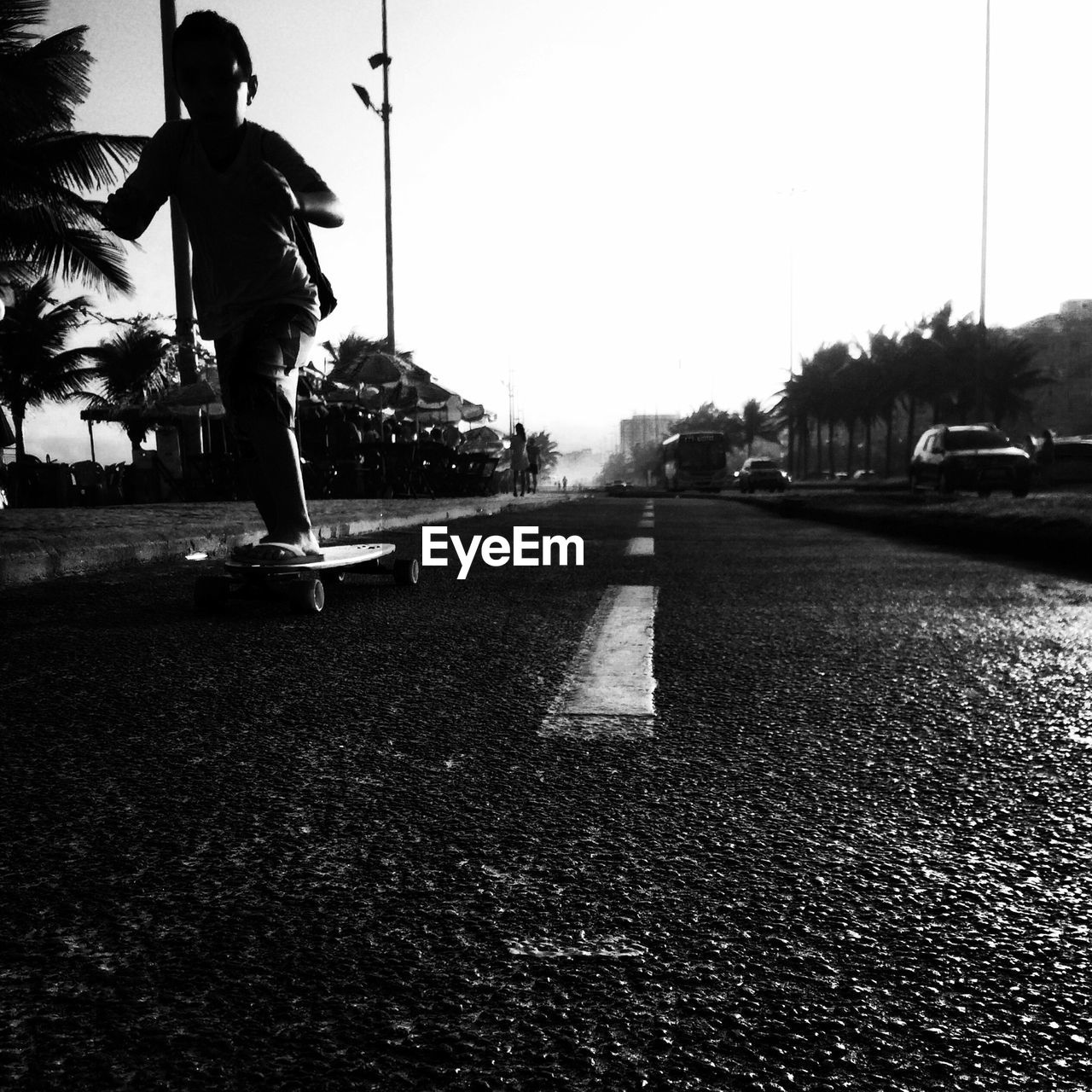 Silhouette of boy skateboarding