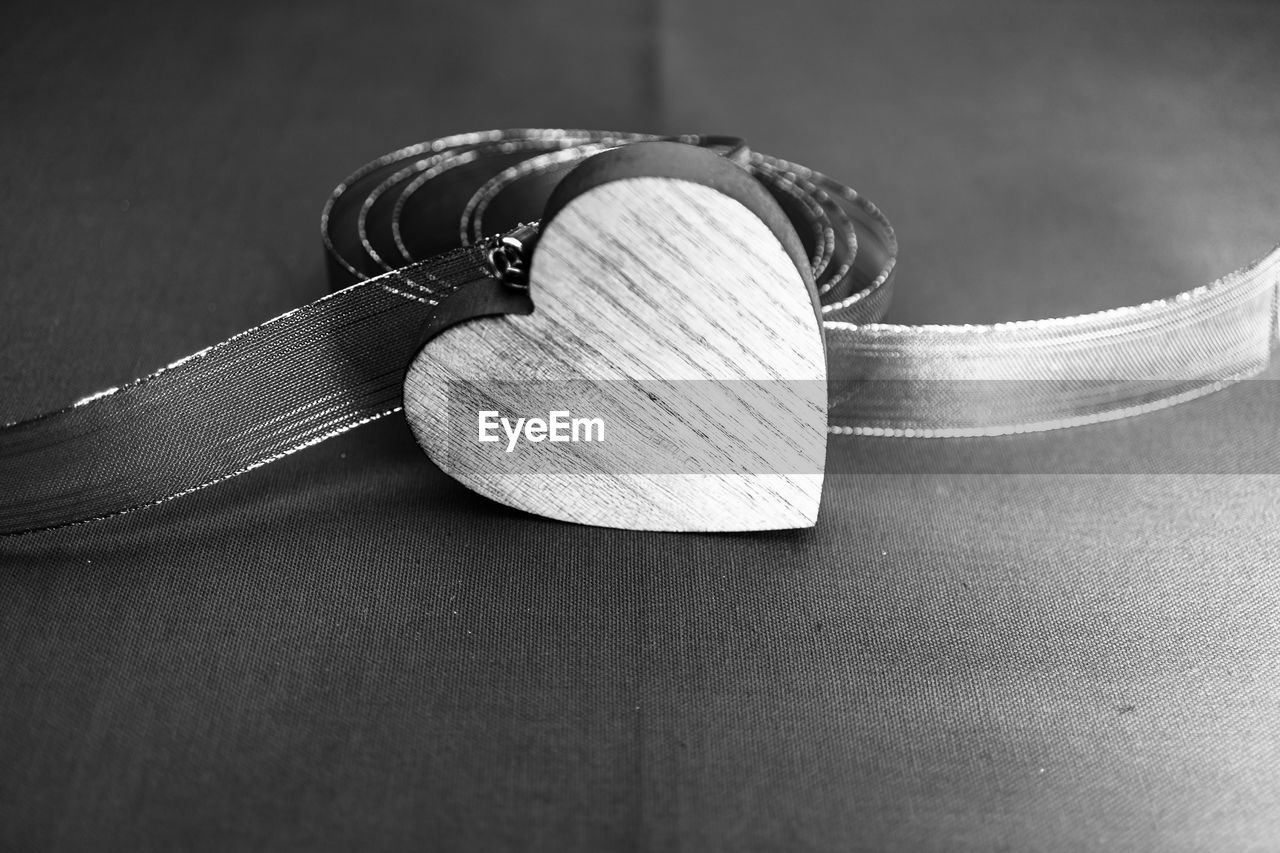 black and white, close-up, black, fashion accessory, hand, white, monochrome photography, jewellery, monochrome, indoors, still life, silver, table, metal