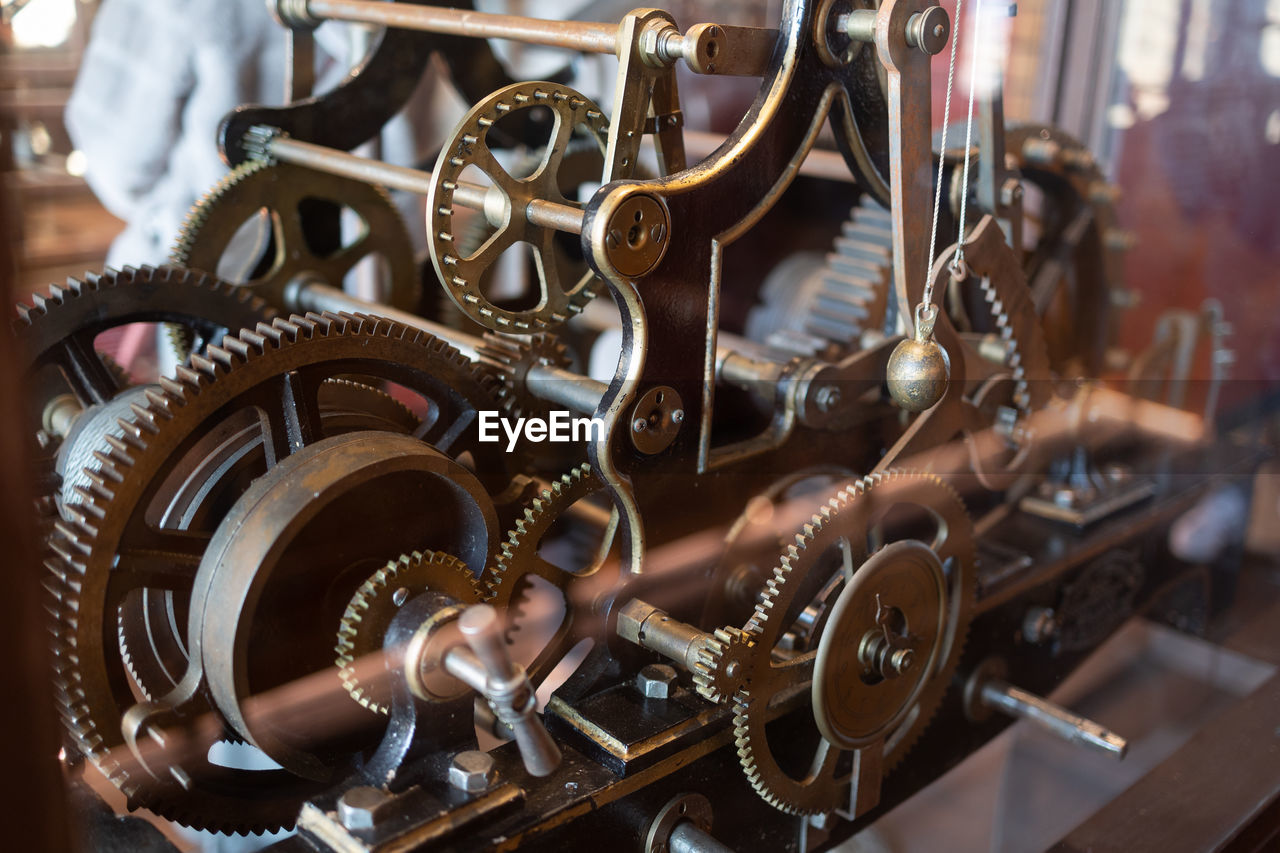 Ancient circular iron mechanisms for the movement of the mechanical clock of a tower.