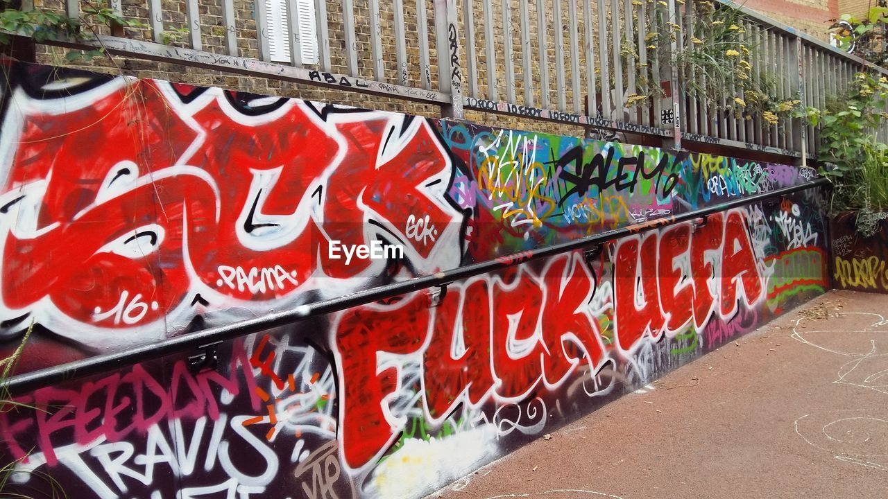 RED GRAFFITI ON WALL