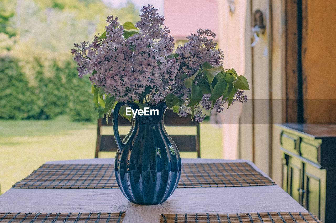 Close-up of flower vase on table