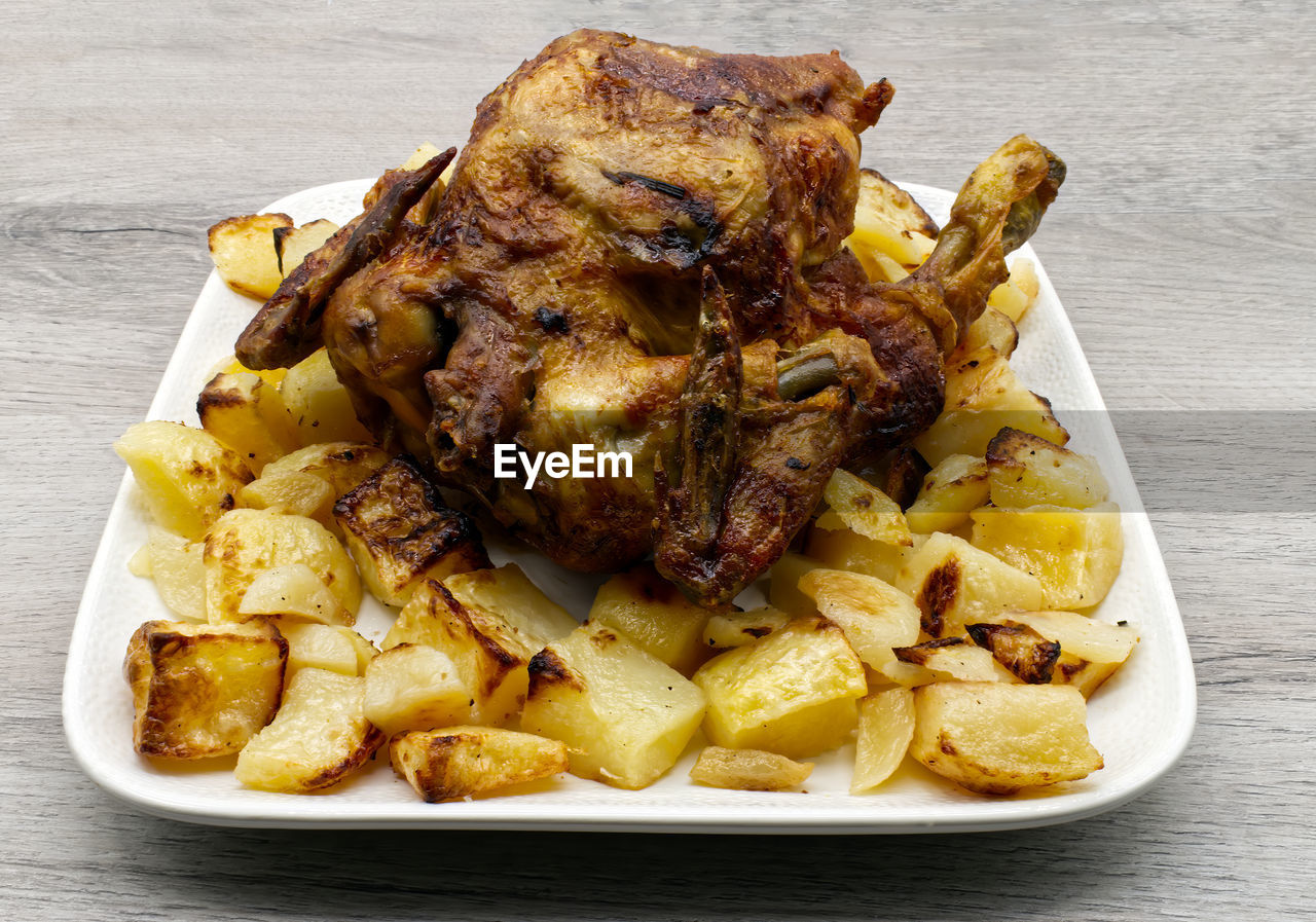 CLOSE-UP OF FOOD SERVED ON TABLE