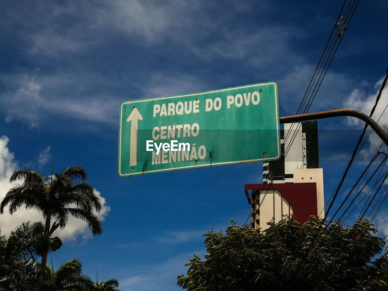 LOW ANGLE VIEW OF SIGNBOARD AGAINST SKY