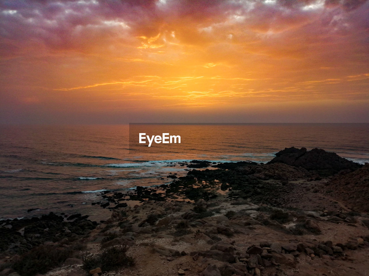 Scenic view of sea against sky during sunset