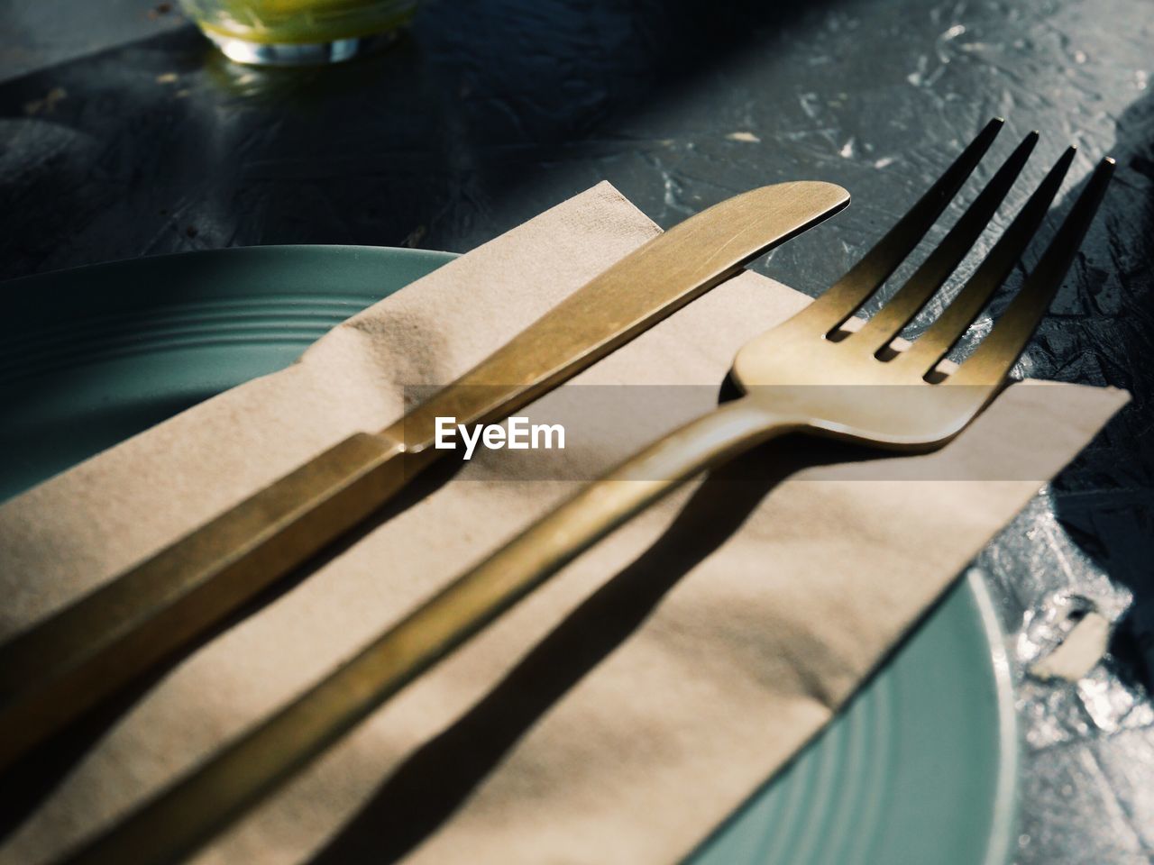 Close-up of fork and table knife on plate