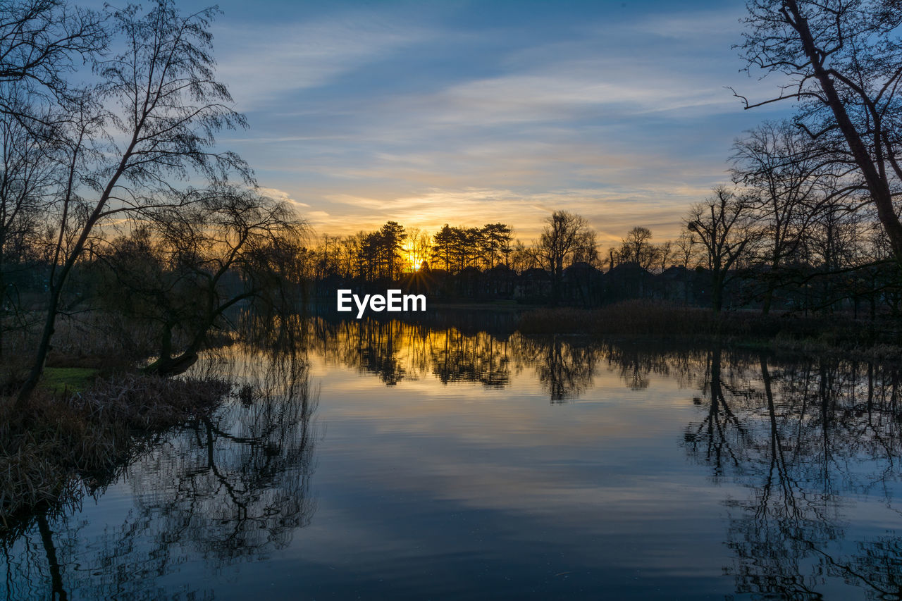 Scenic view of lake against sky during sunset