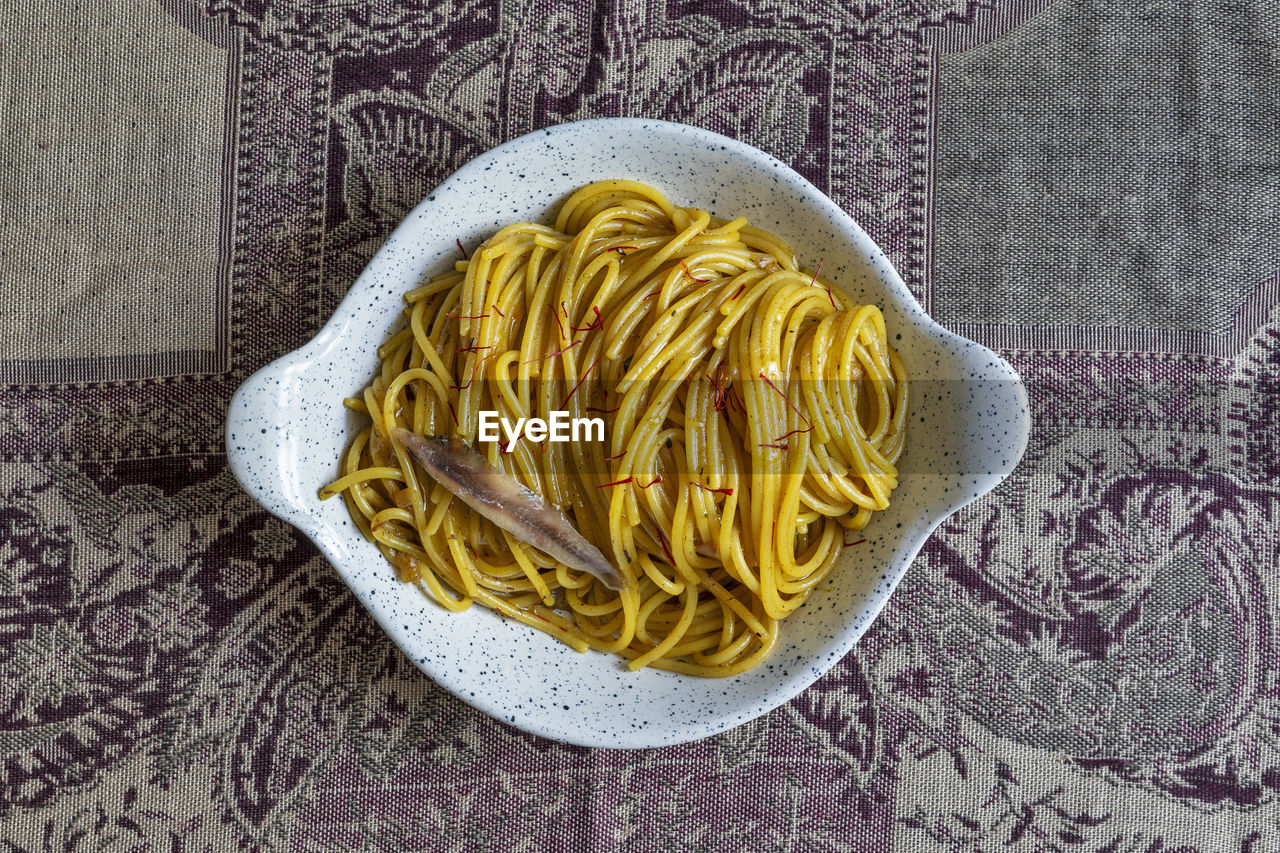 Spaghetti pasta with anchovy and saffron.