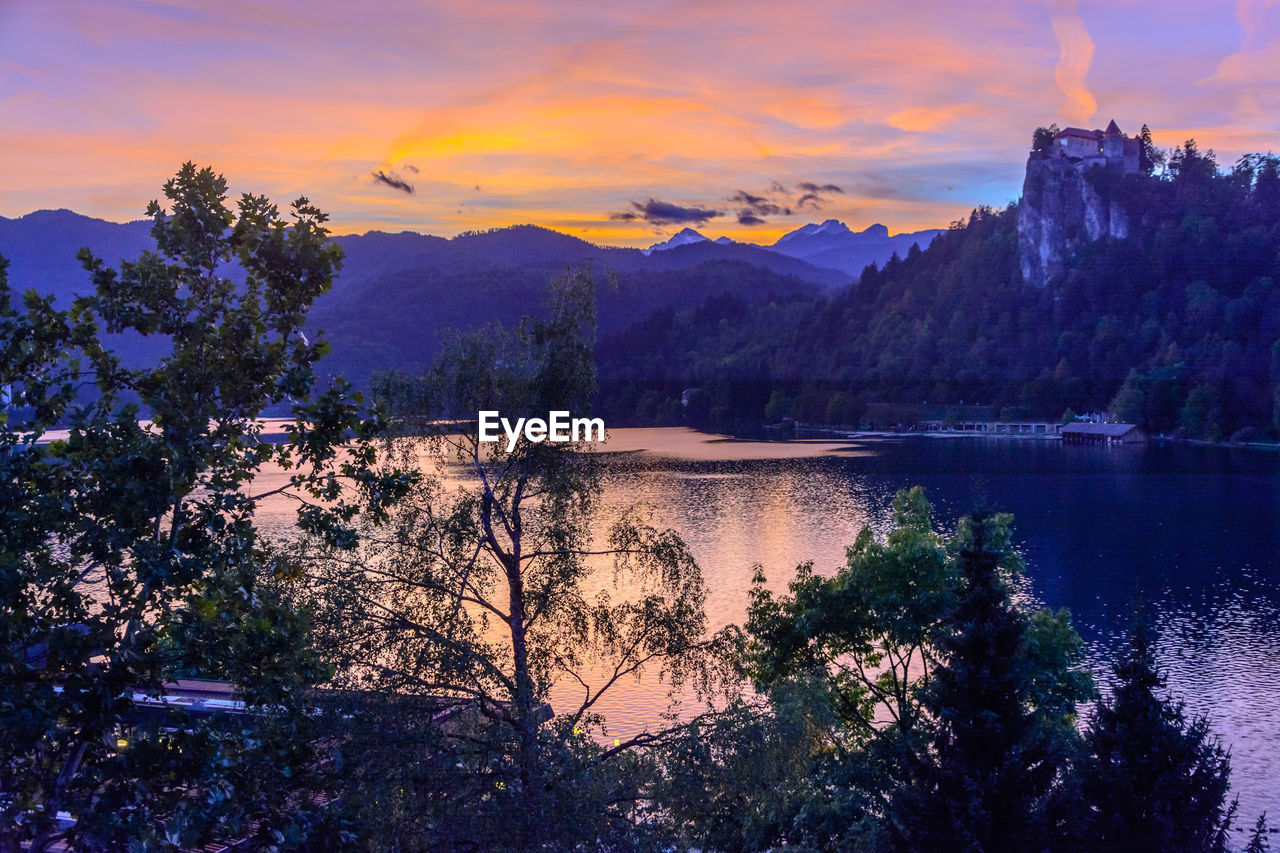 Scenic view of lake against sky during sunset