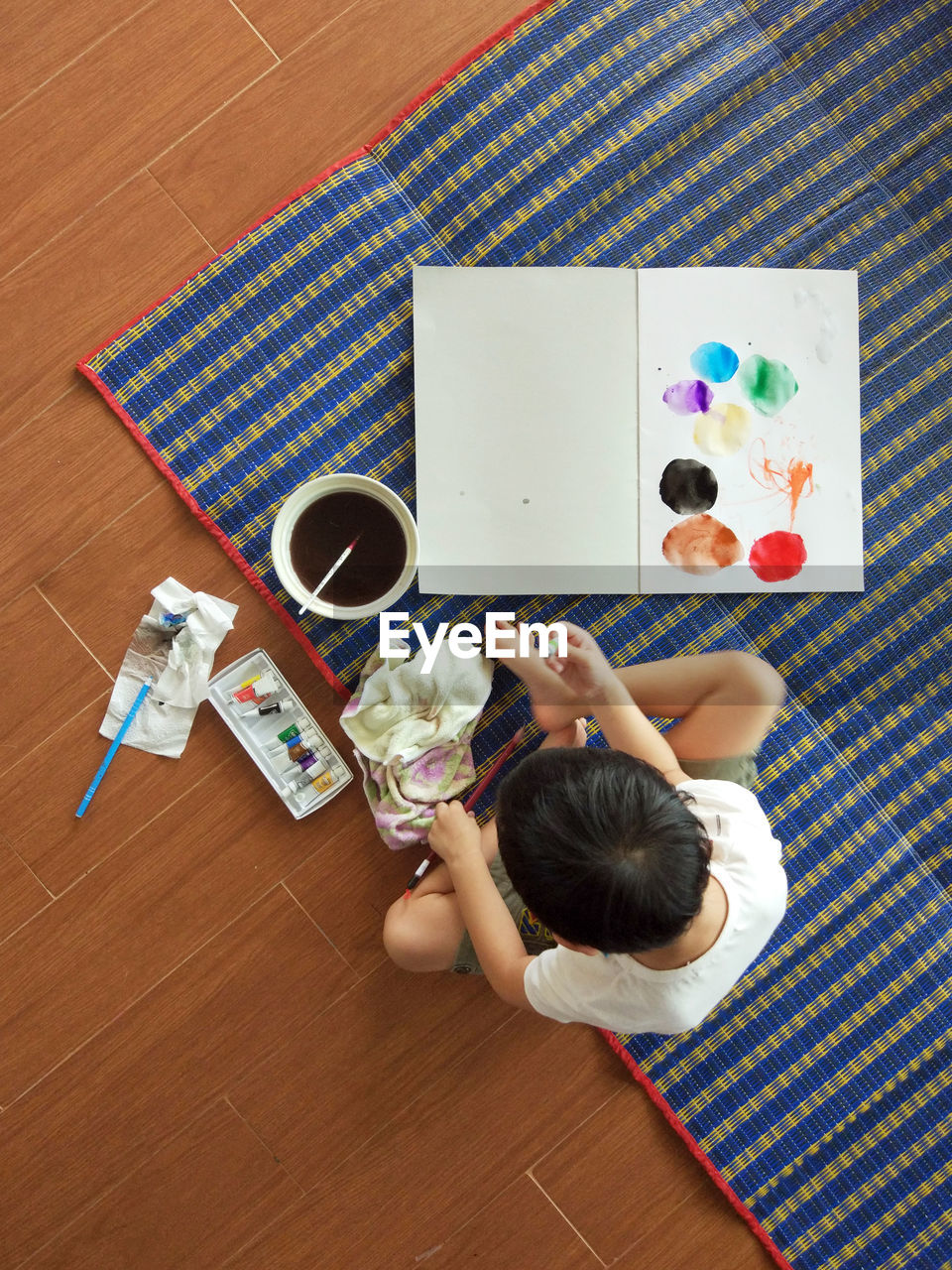 High angle view of child painting