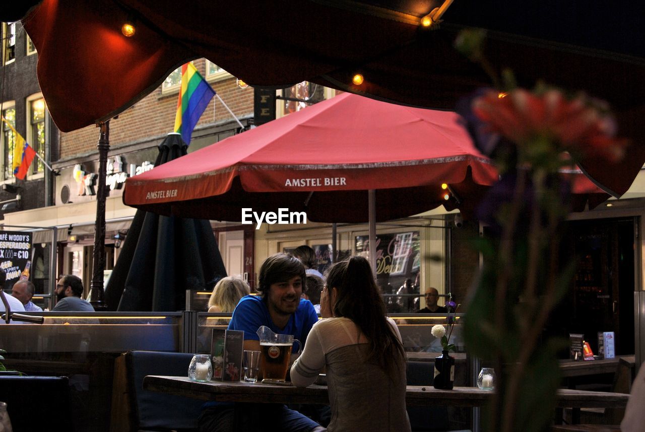 PEOPLE SITTING AT RESTAURANT