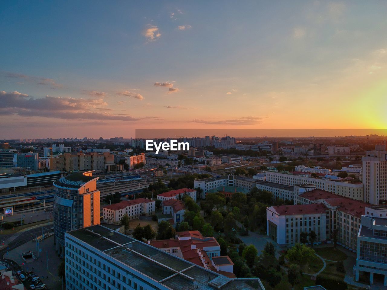 High angle view of buildings against sky during sunset