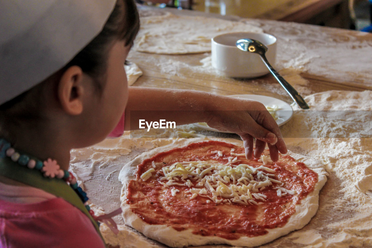 High angle view of girl preparing food