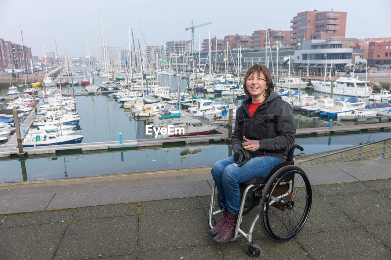 The hague netherlands harbor wheelchair traveling woman happy life 